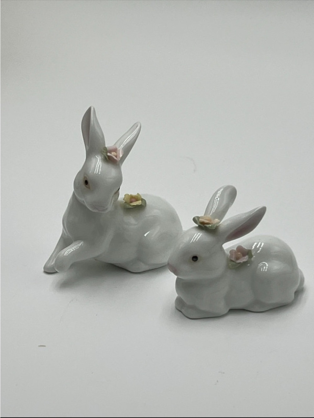 White Ceramic Bunny Figurines with Pink Flower Accents